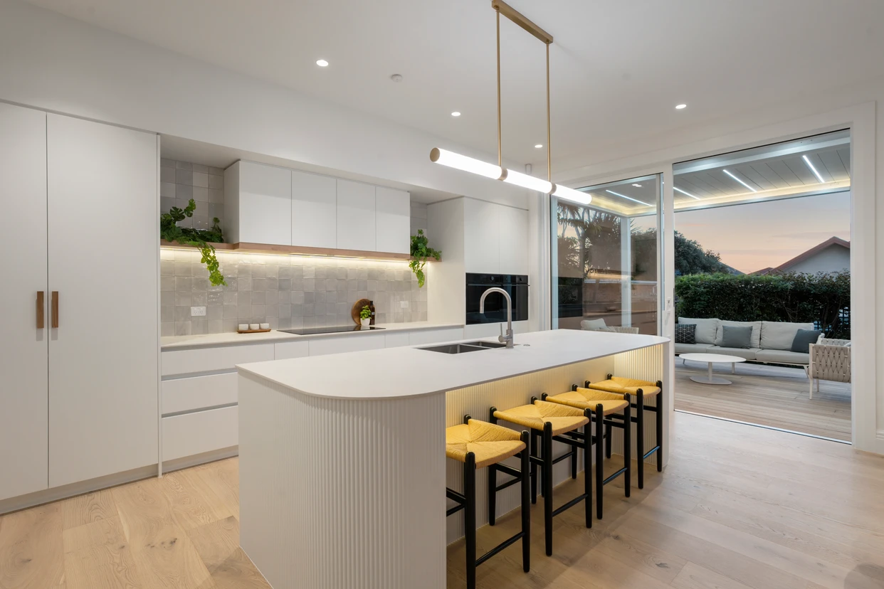 Ngapawa kitchen detail with bar stools and tiled splashback